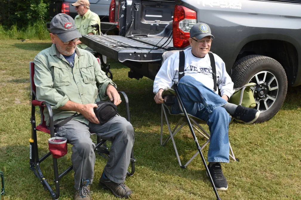 two men sitting in chairs