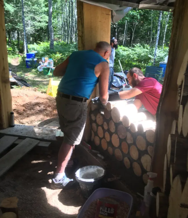 Daniel and Anders laying up cordwood