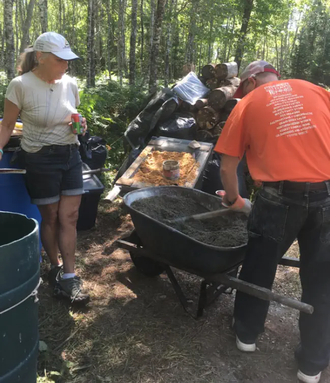 Dodi and Jonny mixing mortar