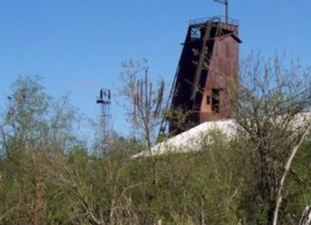 Mine shaft sticking up over trees