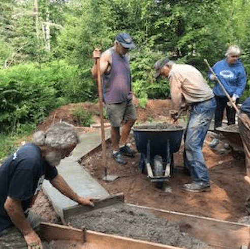 a crew of volunteers helped dig and pour the footing for the octagon shaped shelter