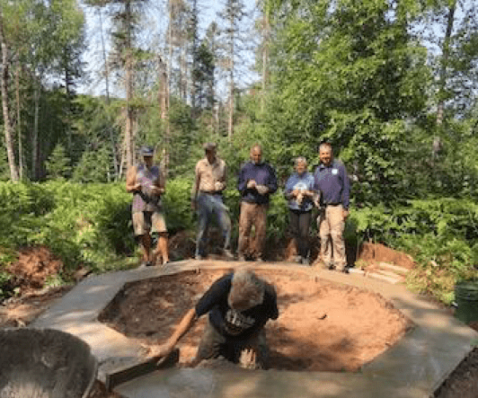 a crew of volunteers helped dig and pour the footing for the octagon shaped shelter