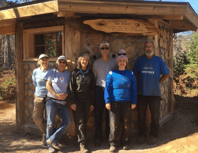 A happy crew paused on cleanup day for a photo